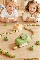 Two kids racing their Game Snakes on the living-room floor